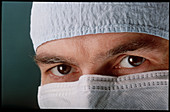 Masked face of a male surgeon