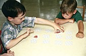Children playing cards during occupational therapy