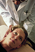 Chiropractor manipulating cervicals