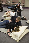 Expectant couples practicing breathing techniques