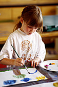 A Seven-Year-Old Girl Painting