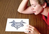 Woman taking Rorschach Ink Blot Test