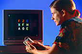 Woman undergoing a computerised psychological test