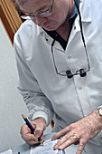 Doctor Writing a Prescription