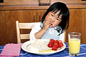 Korean Child Eating Lunch