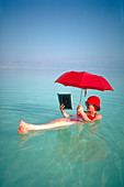 Woman afloat in the Dead Sea