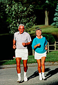 Elderly couple jogging to keep fit