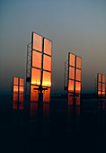 The light of sunset on mirrors of solar power stn