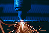 Industrial laser cutting holes in Kevlar-epoxy