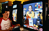 Scientist demonstrating high-definition TV system