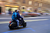 People Riding a Scooter in Rome,Italy