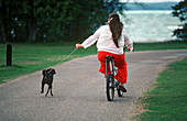 Woman Exercising Her Dog