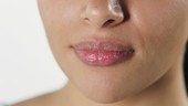 Woman licking lips
