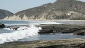 Waves crashing onto beach, Ecuador