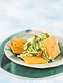 Spicy macadamia cheese crackers with courgette salad