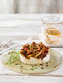 Cashew nut cream with marinated dried tomatoes and onions