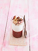 Vegan cashew cream with strawberry marmelade and a crunchy topping