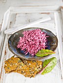 Macadamia cream with beetroot and garlic crackers with sunflower seeds