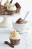 Chocolate fudge cupcakes on a cake stand