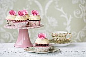 Afternoon tea with rose cupcakes served on vintage china