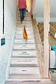 Restored wooden staircase with lettering on risers