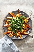 Glazed sweet potato wedges with lamb's lettuce, chestnuts and toasted pumpkin seeds