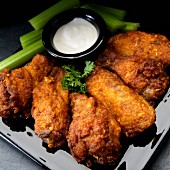 Buffalo chicken wings with garlic, celery and ranch dressing