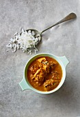 Chicken and coconut curry with a spoonful of rice