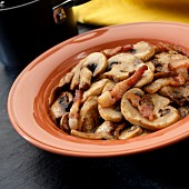 Sautéed mushrooms with bacon strips