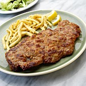 Wiener Schnitzel (breaded veal escalope from Vienna) with Spätzle (soft egg noodles from Swabia)