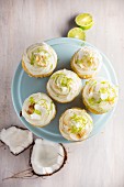 Lime and coconut cupcakes on a cake stand