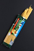 An open pack of spaghetti