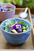 Chicken and grape salad with edible flowers