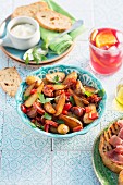 Fried potatoes with chorizo, peppers and parsley