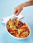 Linguine with tomatoes, olives, capers and red pepper