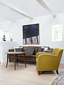 Retro furniture and white ceiling beams in bright living room