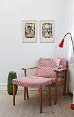 Retro armchair and footstool with red and white patterned covers