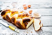 Challah (a Jewish sweet bread plait) with ingredients and coffee