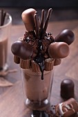 A chocolate freak shake with chocolate-coated marshmallows