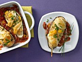 Aubergines stuffed with rice and tomato sauce