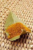 Curry powder on a leaf (close-up)