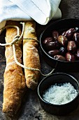 An arrangement of olive bread, olive and sea salt