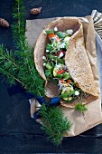 A wholemeal tortilla with vegetables