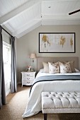Elegant attic bedroom in shades of cream