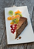 A slice of chestnut cake with citrus fruit