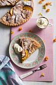 A nectarine and almond cream tart with whipped cream