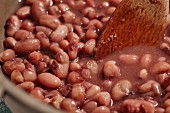 Anasazi bean stew with a wooden spoon (USA)