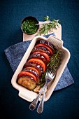 Gratinated aubergines and tomatoes with rosemary and pesto