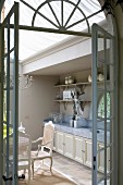 View into vintage-style kitchen through open lattice door