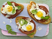Strammer Max (bread topped with ham and a fried egg) with quail eggs and bresaola
